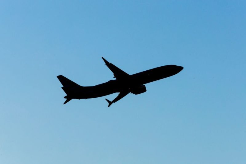 american airlines flight makes emergency landing after passenger's device catches fire: officials