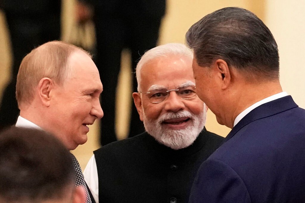 car rides and hand holding: putin, modi and xi send trump a pointed message